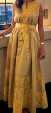 Custom silk embroidered dress in a sleeveless design with intricate yellow embroidery, a belted waist, and flowing long skirt.